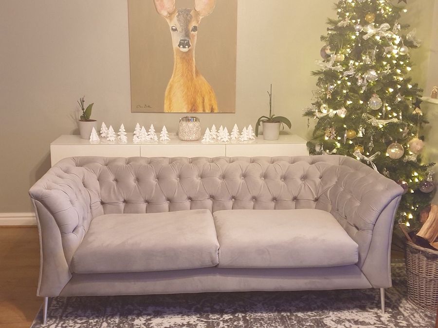 Chesterfield Modern grey sofa on silver legs, christmas decoration