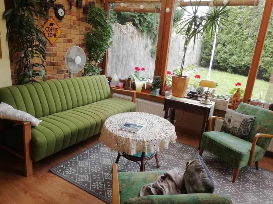 Green fabric sofa in winter garden