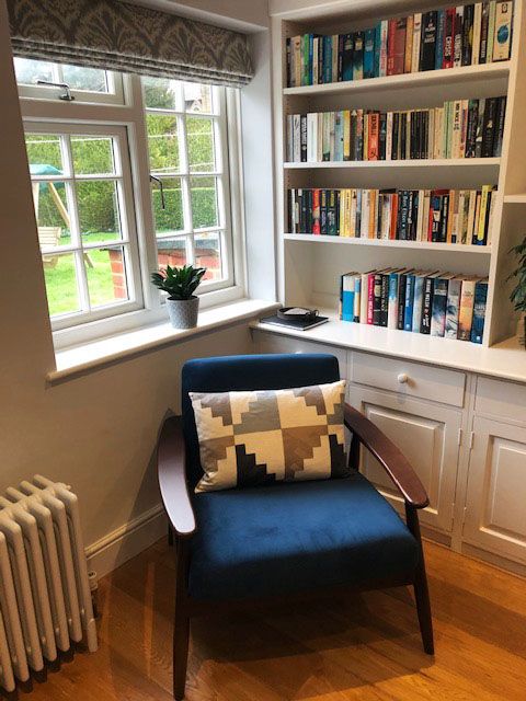 Demure blue armchair by Rebecca